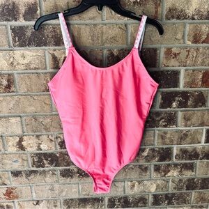 Vibrant Pink Swimsuit with White Accents